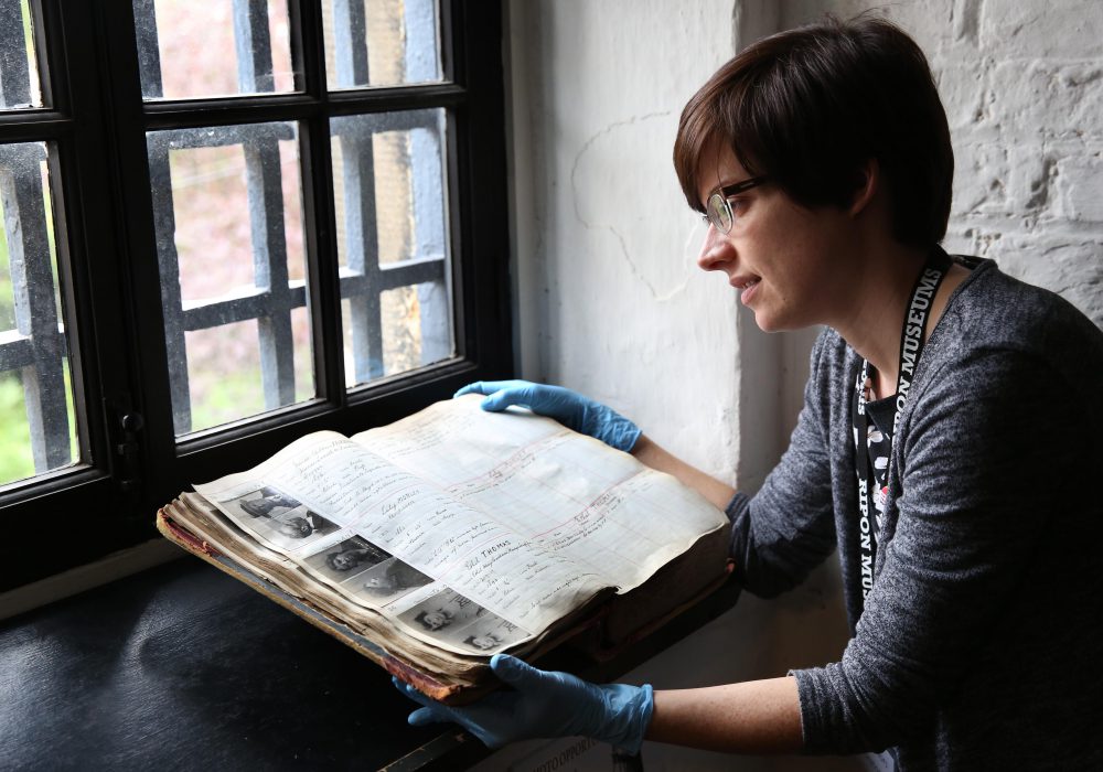 Curator examining a historic book