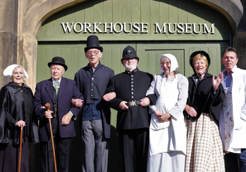 Volunteers in costume outside the Workhouse Museum