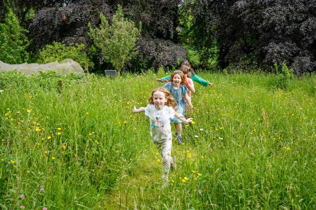 Children running in the Ripon Museums Victorian gardens this summer