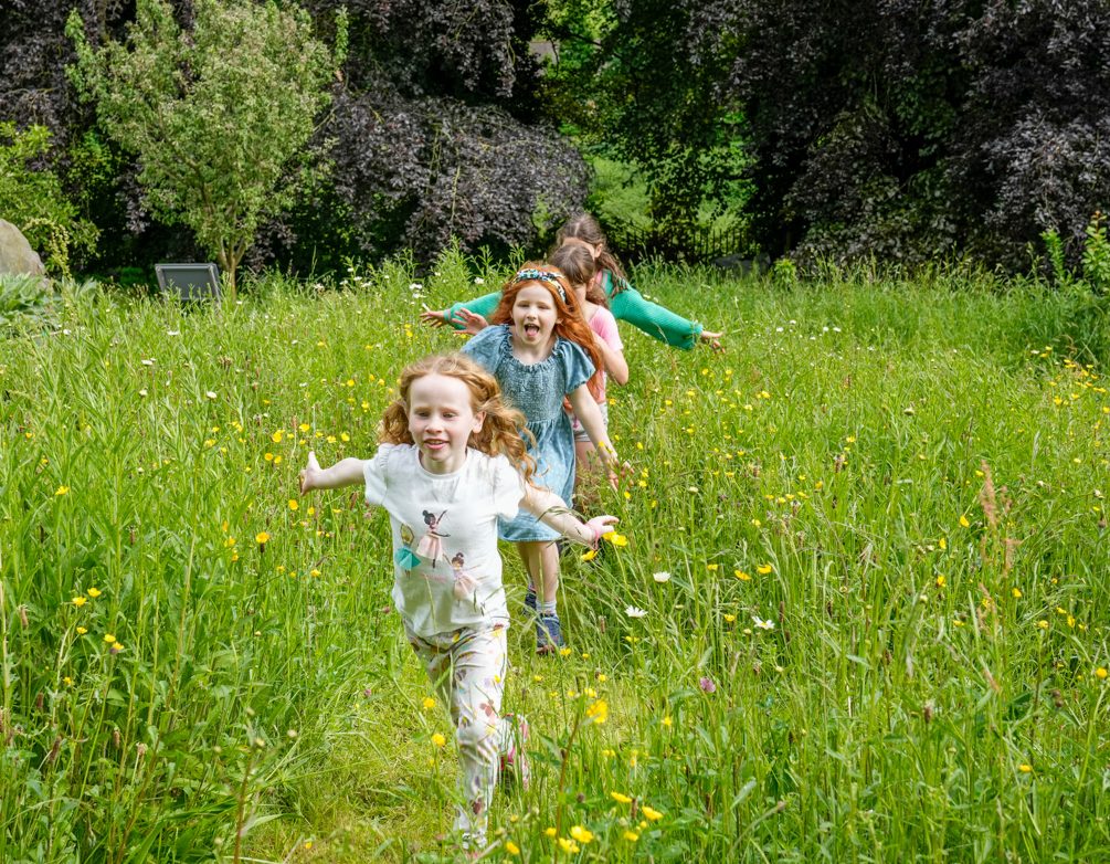 Children running in the Ripon Museums Victorian gardens this summer